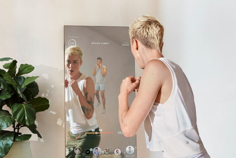 Person boxing in front of the smart mirror