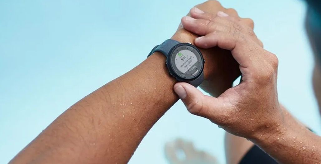 Person using the Garmin Swim 2 watch while in water