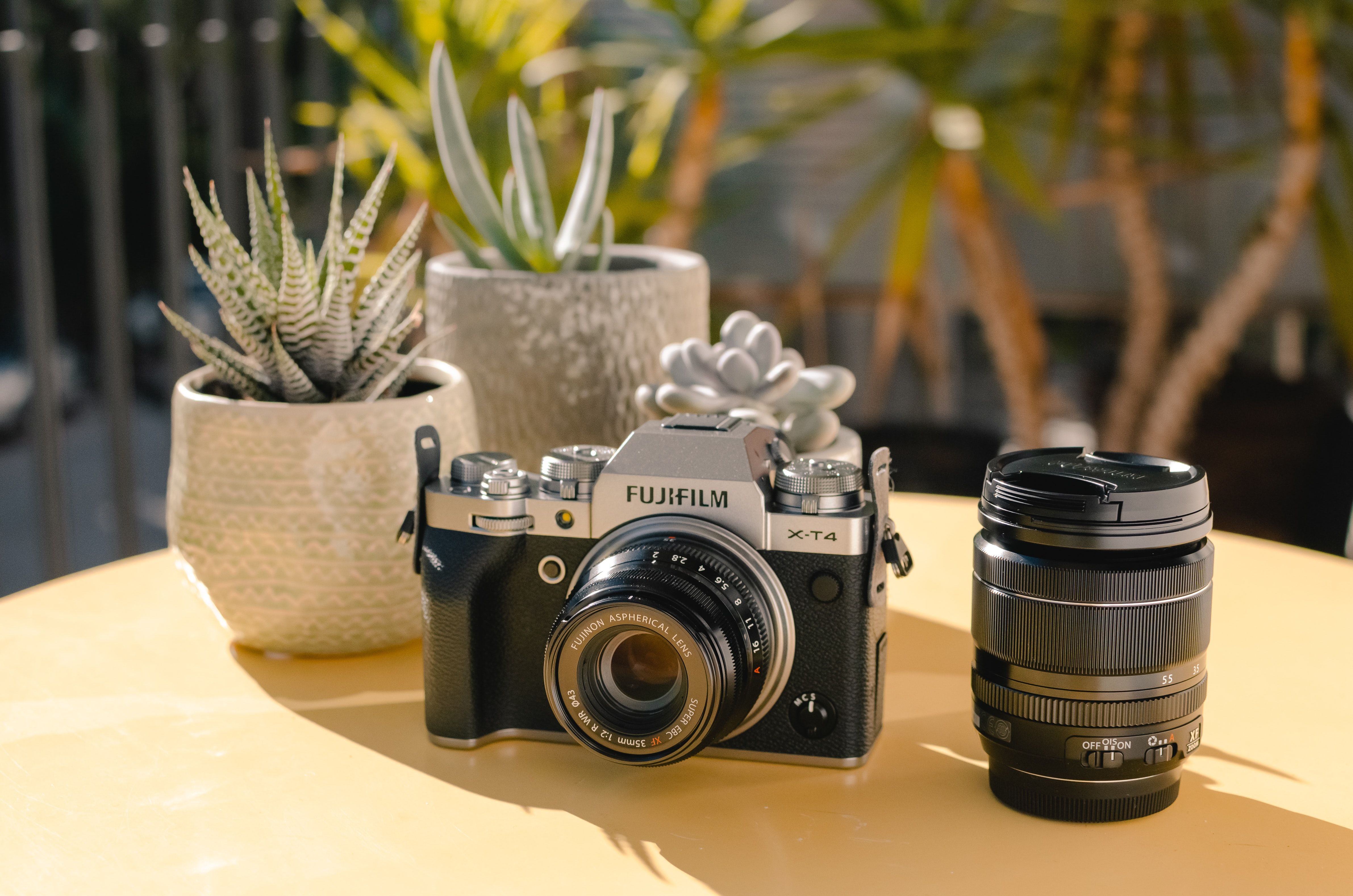 Photo of a Fujifilm camera next to the lens