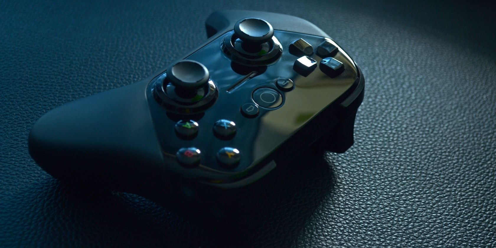 Wireless game controller on black leather