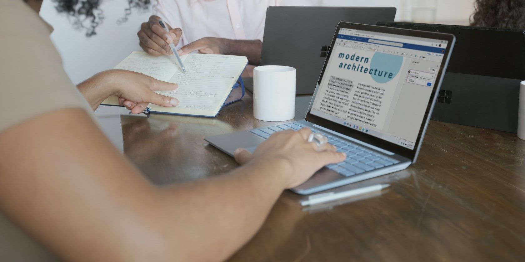 Person Working on a Word Document on a Laptop