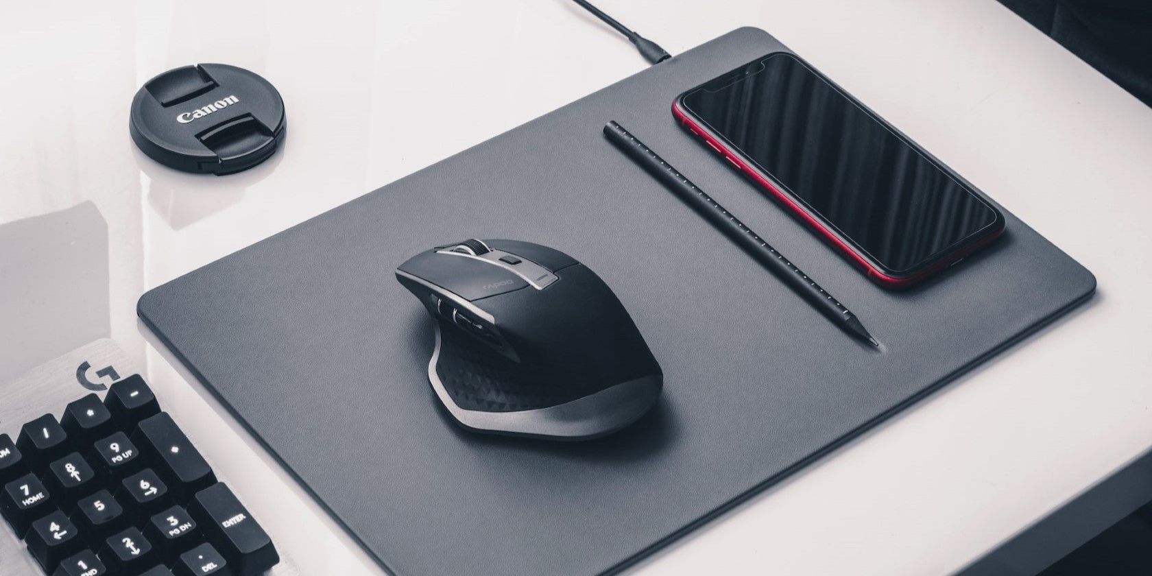 A black mouse on a mouse pad