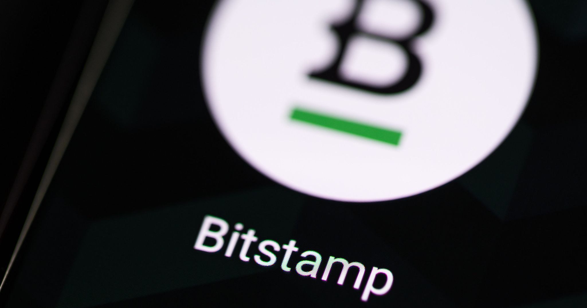 a photo of the BitStamp app icon on the screen
