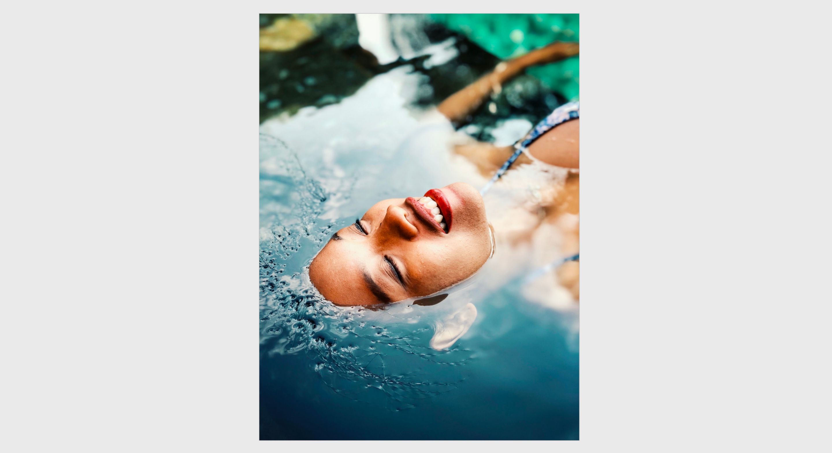A womans face semi-sumberged in water