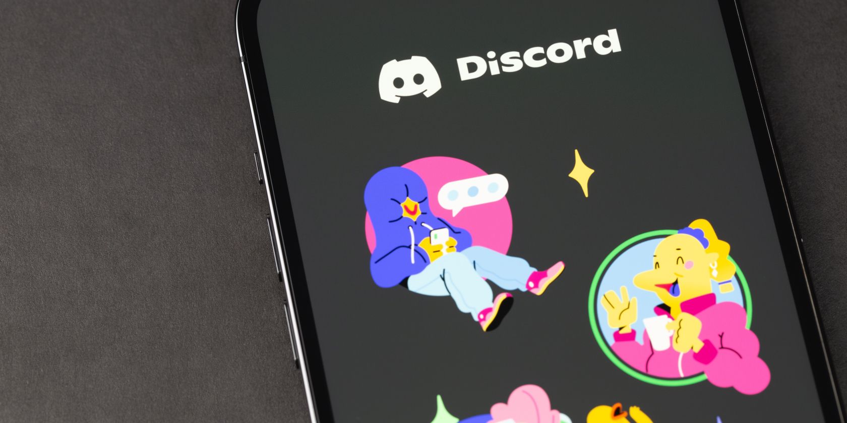 discord logo and colorful characters on phone screen