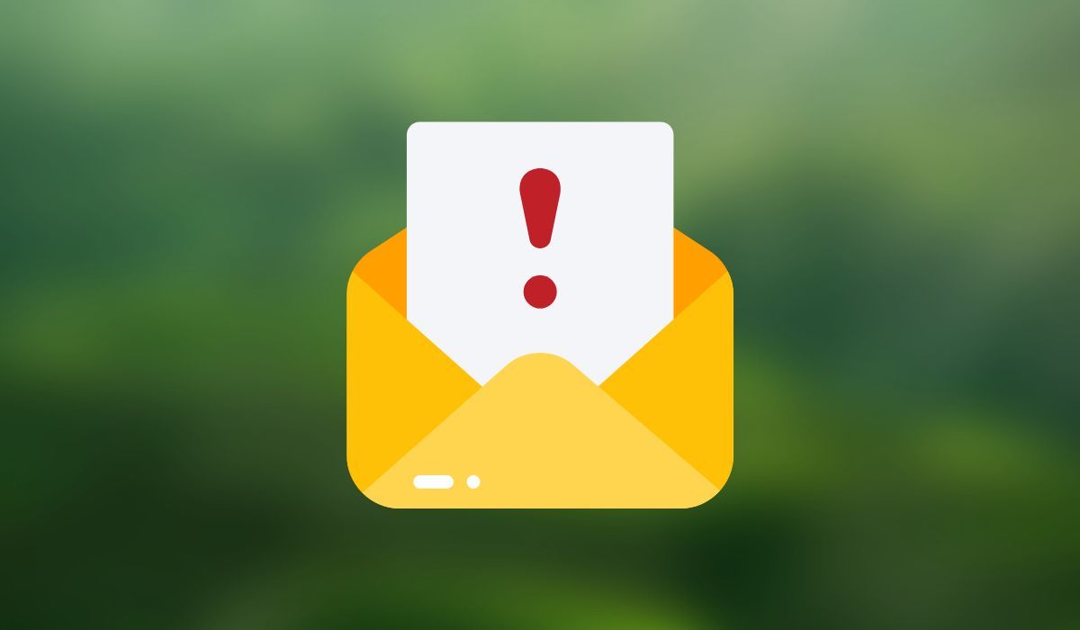 Email symbol with exclamation mark seen on green background