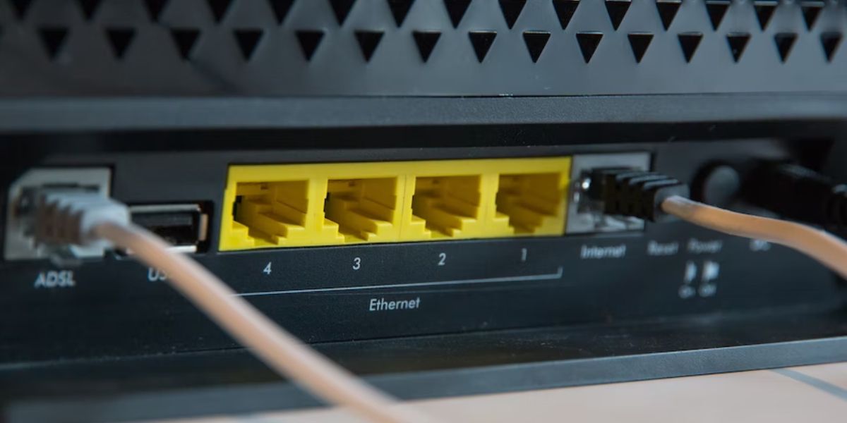 Ethernet connection ports with cords inserted into a router