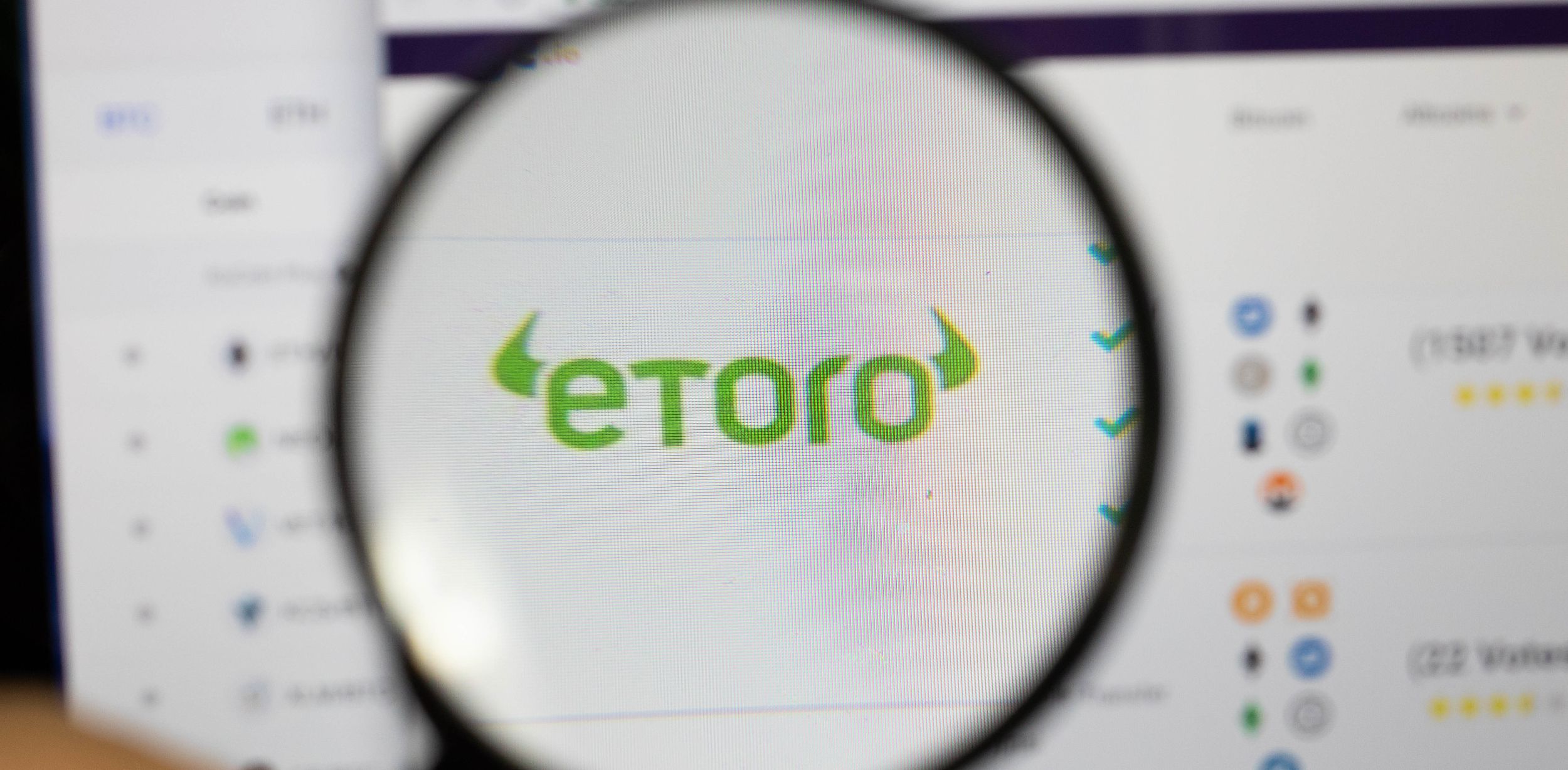 etoro exchange logo on computer screen