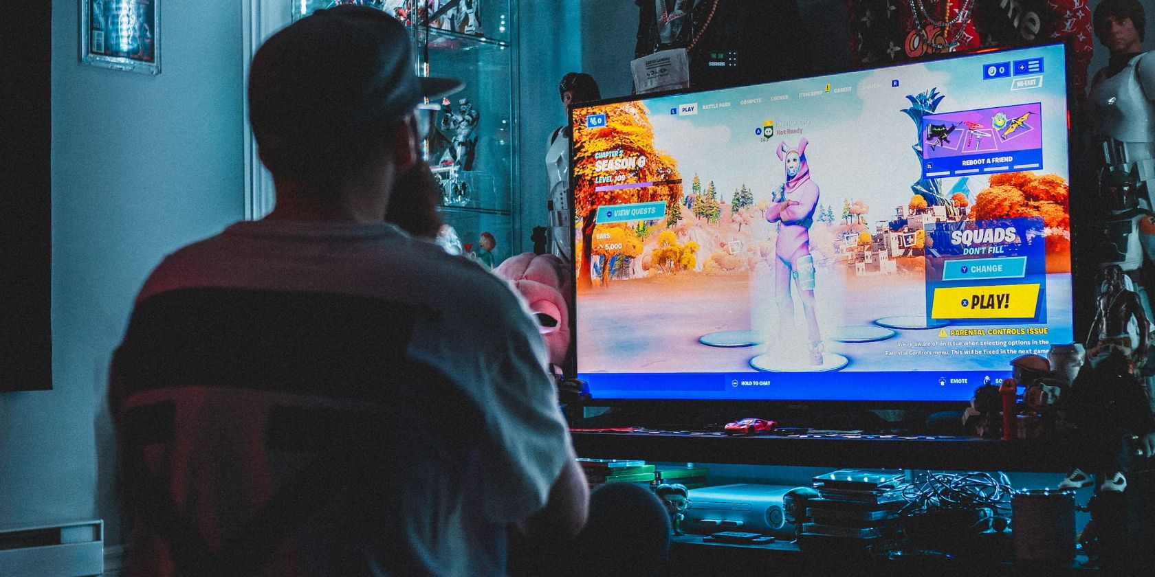Gamer playing Fortnite on his TV