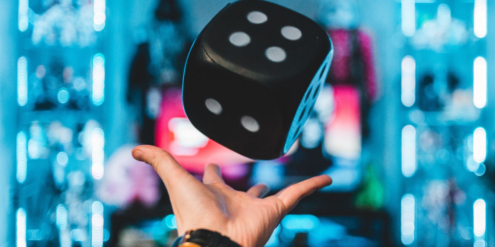 Giant dice floating over a palm