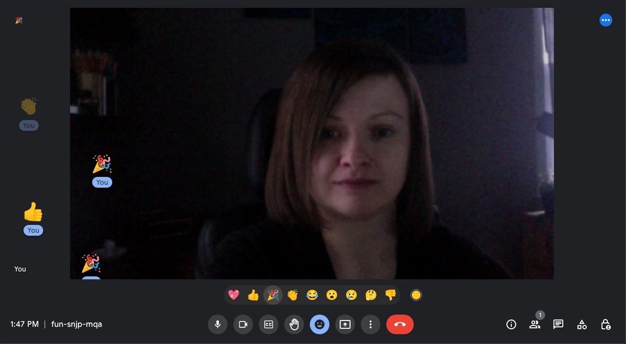 Online video call meeting with emoji floating on screen