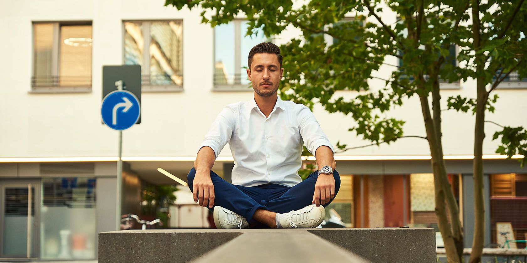 Person doing seated meditation outdoors