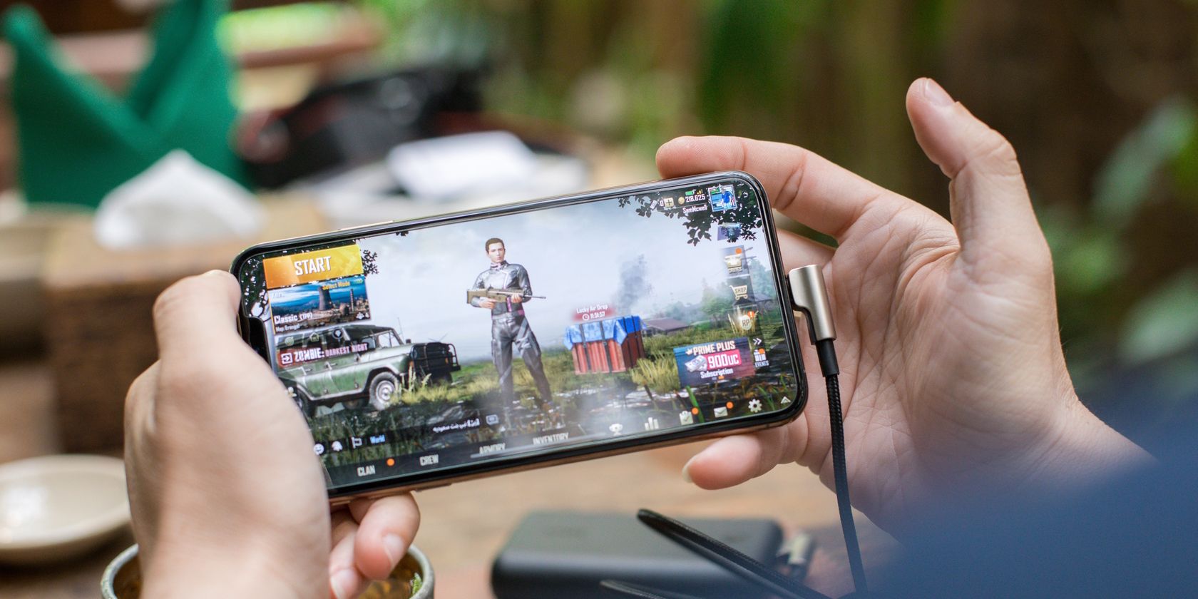 Person Playing PUBG Mobile on Smartphone