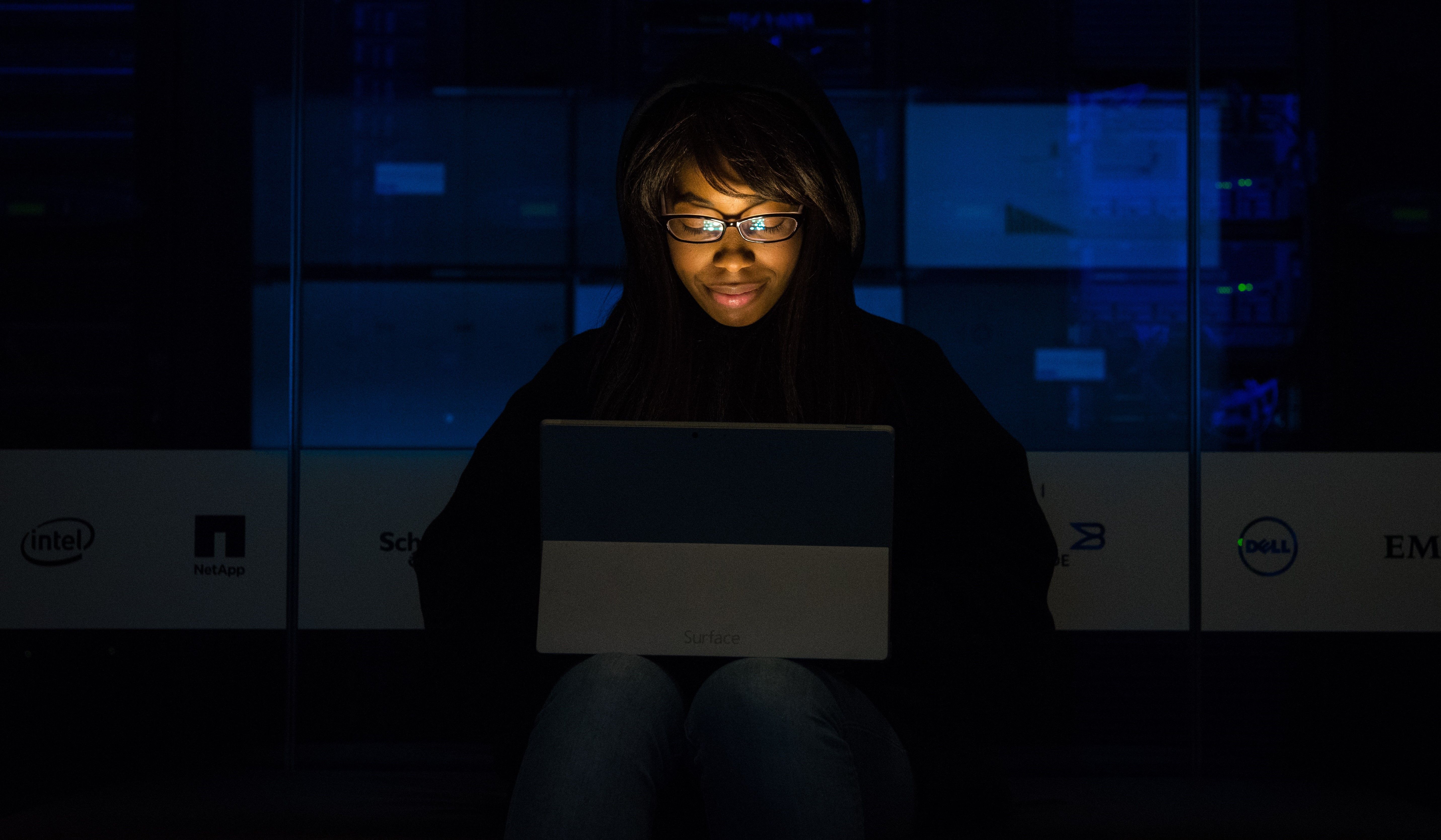 person-working-on-laptop-in-dark
