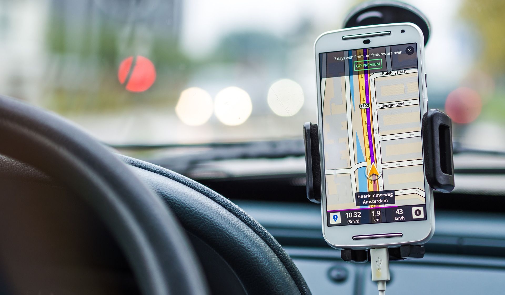 phone displaying map on car dashboard