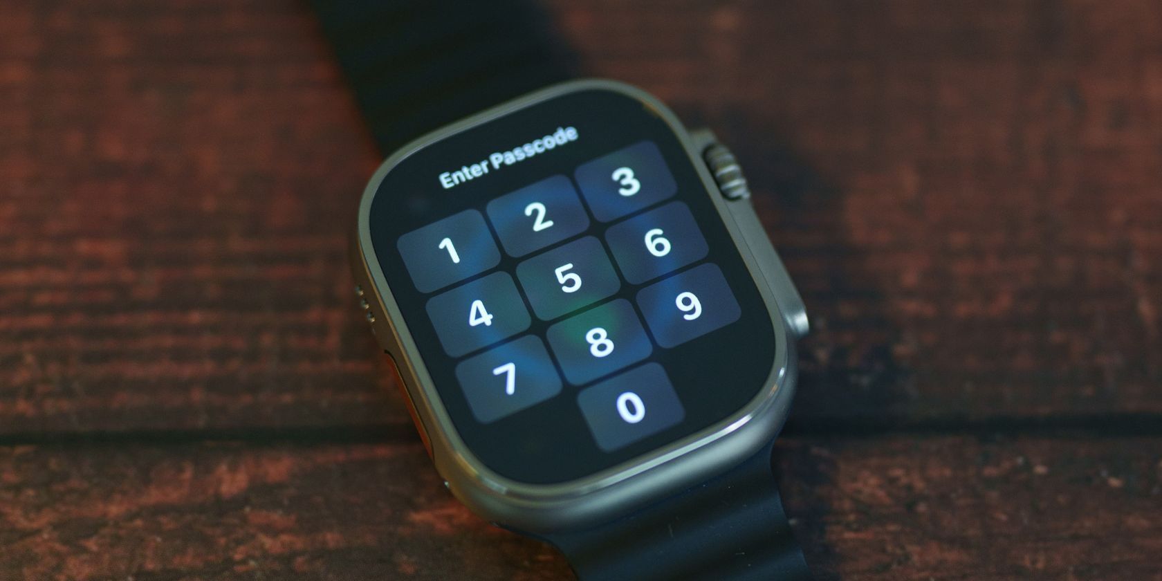 smartwatch on table displaying lock screen