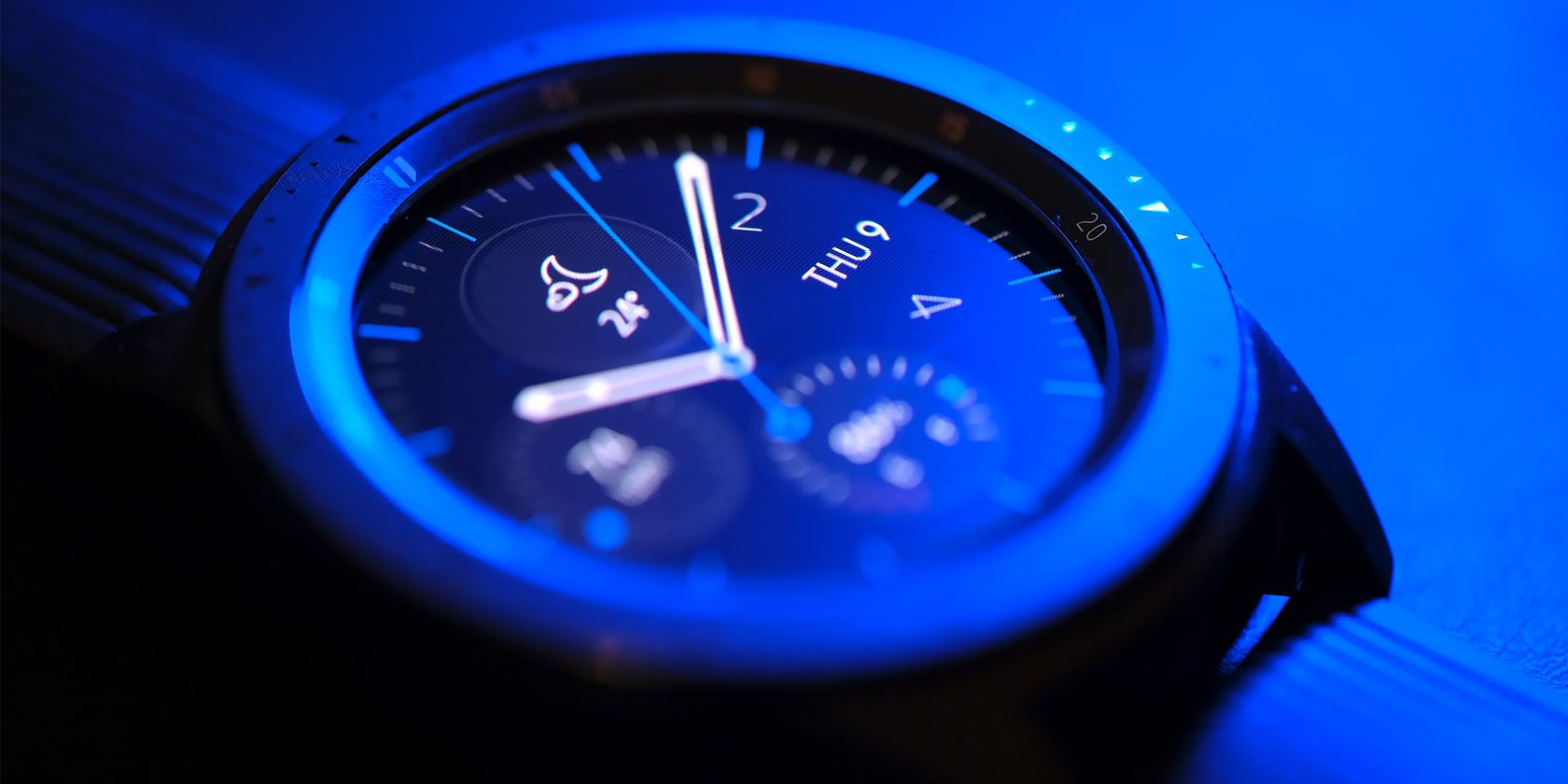 A close up image of a hybrid smartwatch
