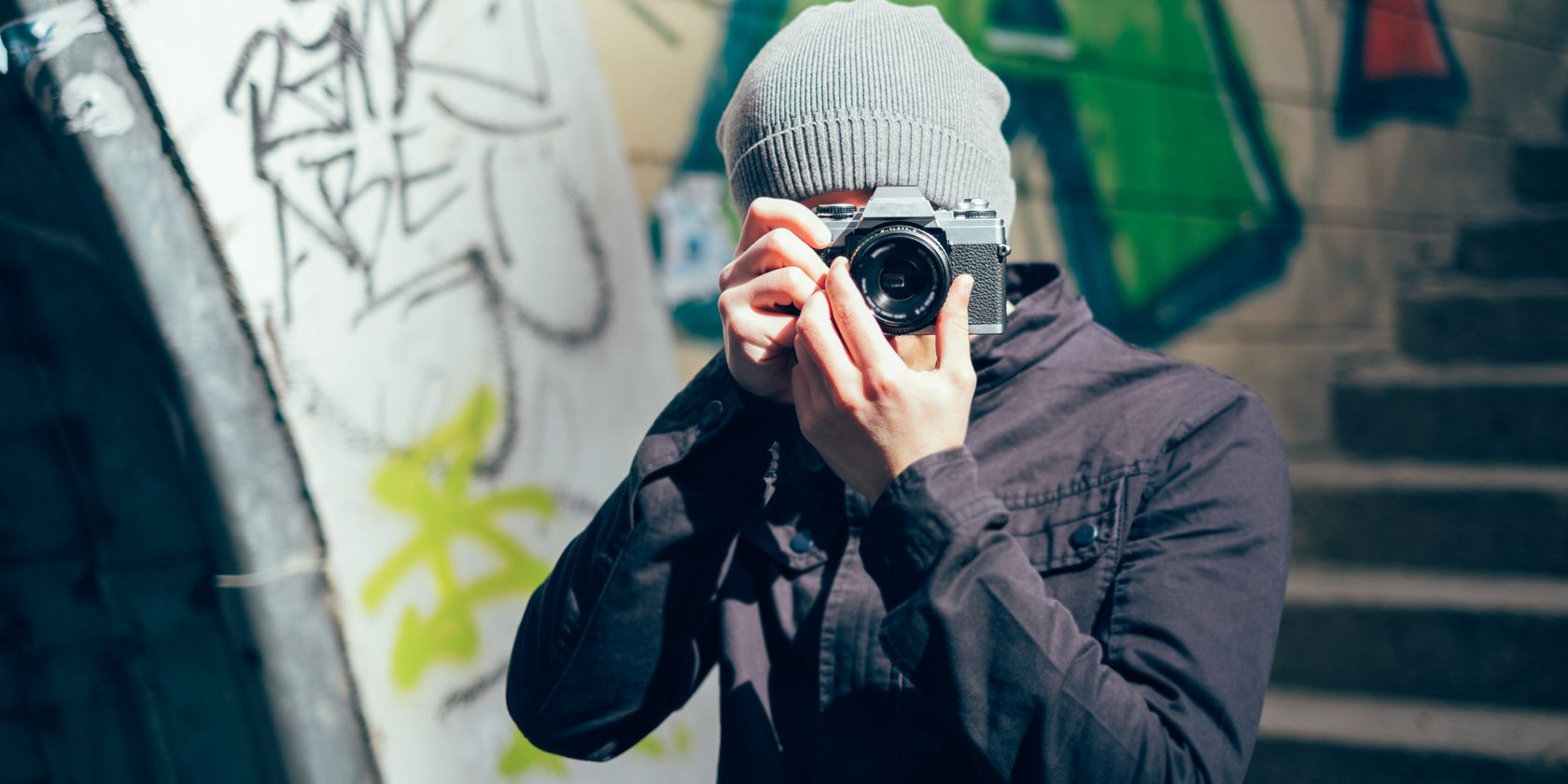 A person looking through a camera lens taking a photo of the photorgapher