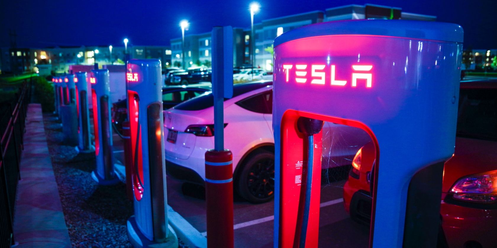 Tesla Supercharger station at night