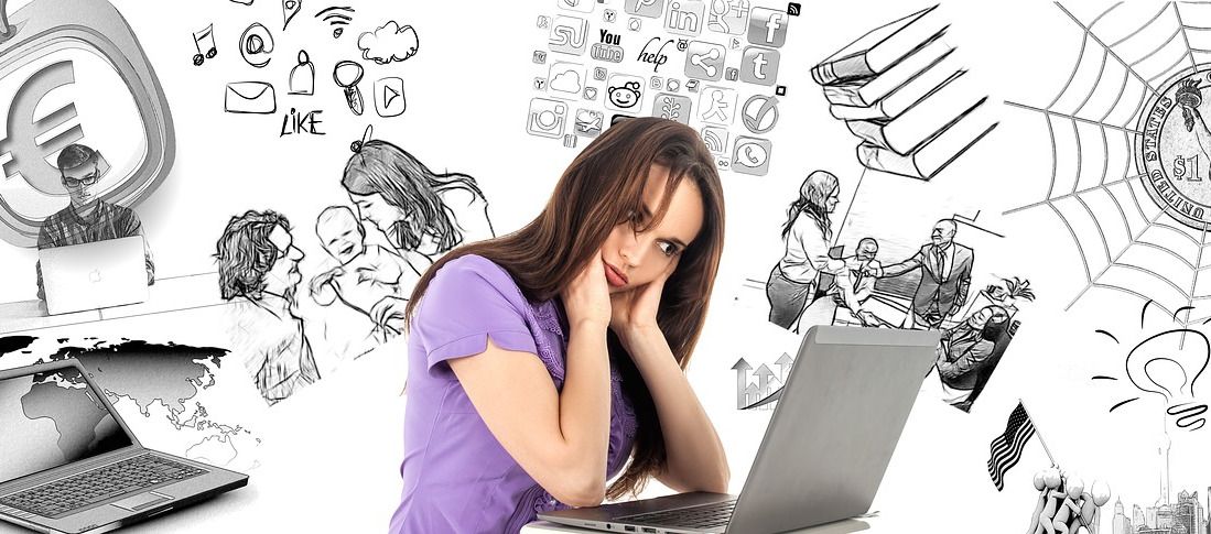 tired woman looking at laptop