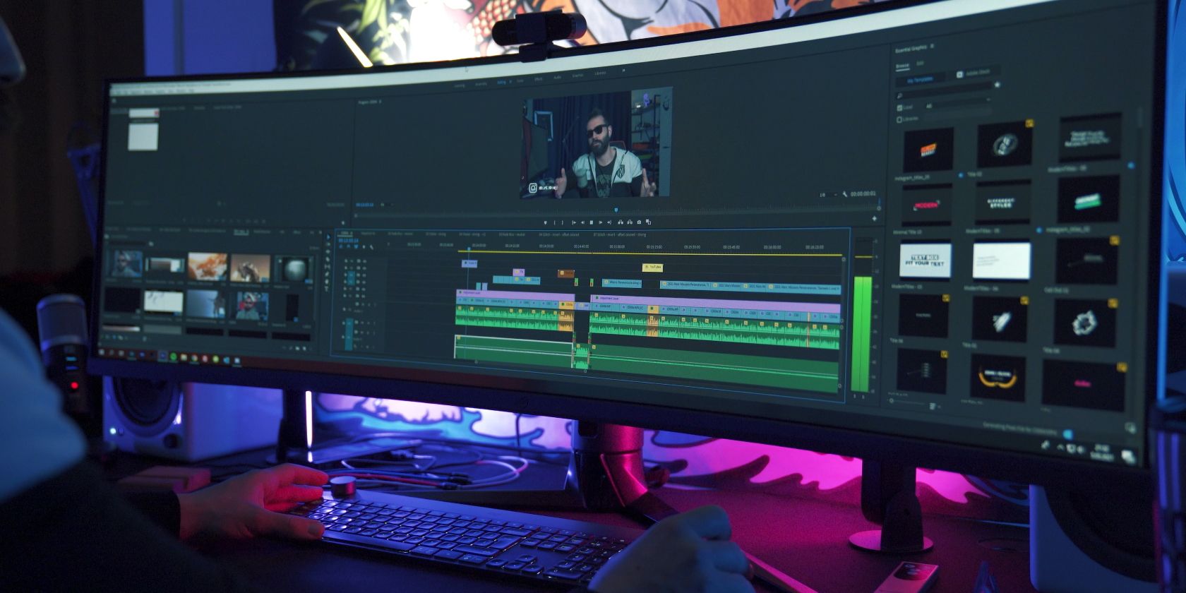 Photo of Man Editing Video on Ultra Wide Computer