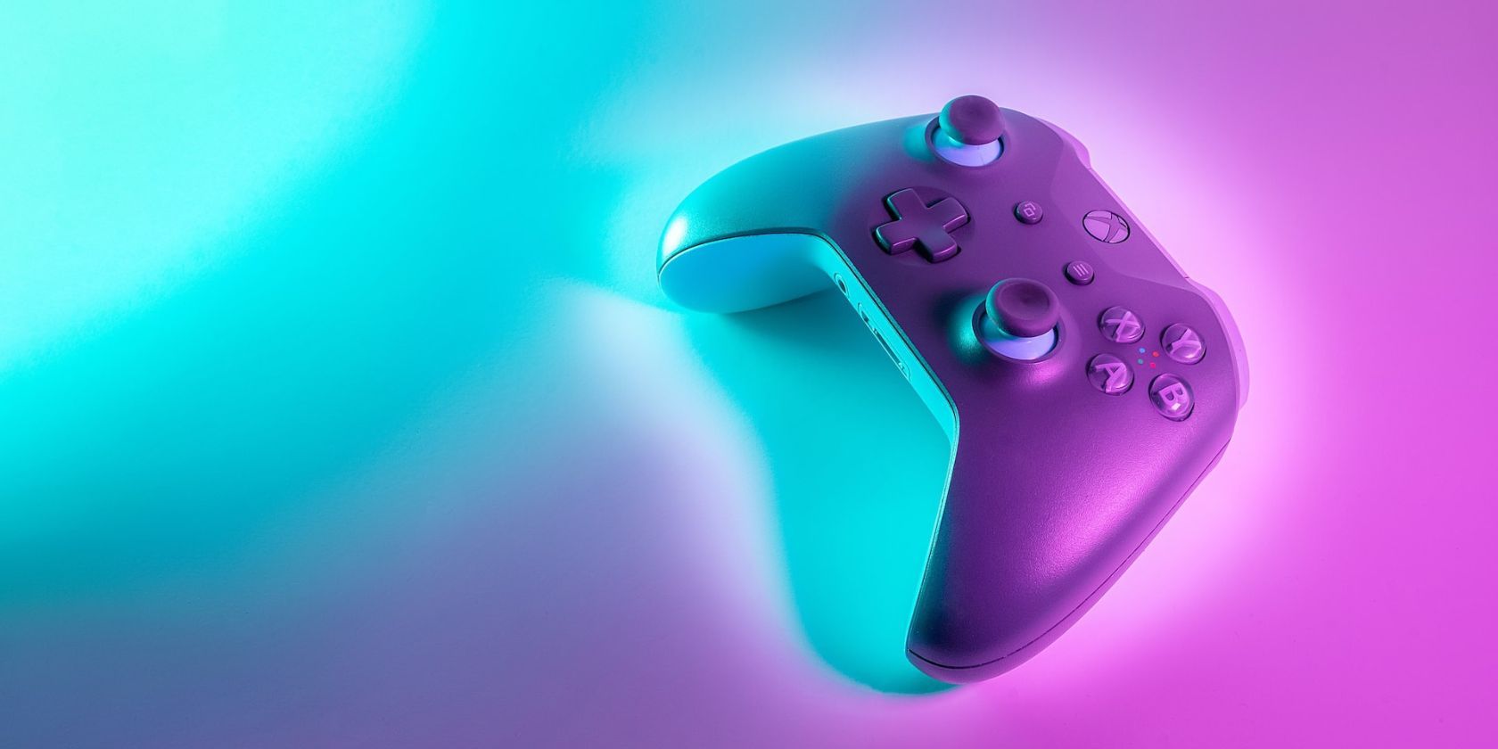 an Xbox game controller on a gradient background