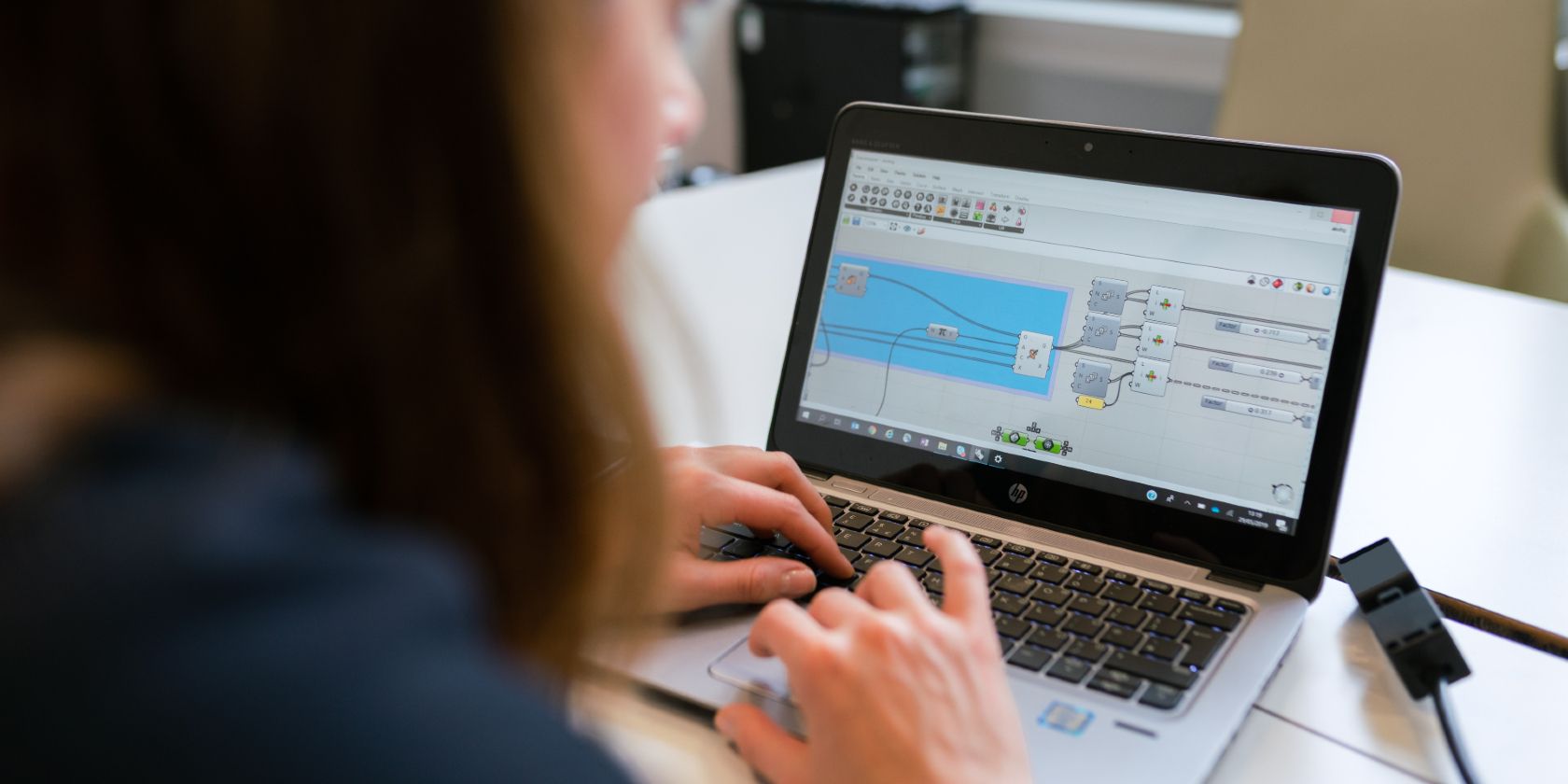 An engineer using a laptop