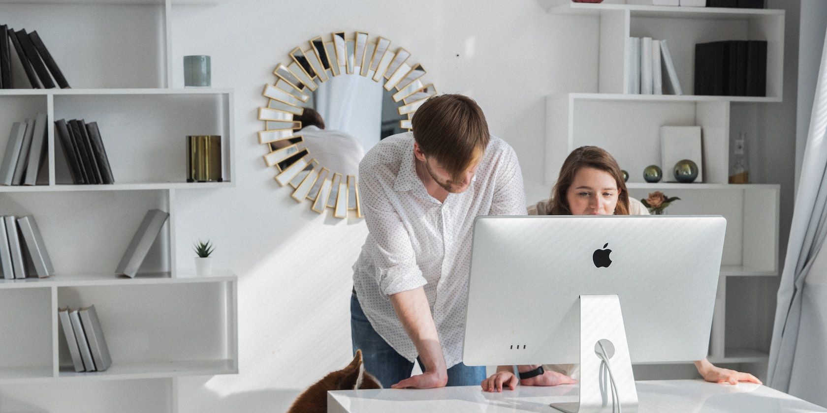 Woman and man setting up iMac together