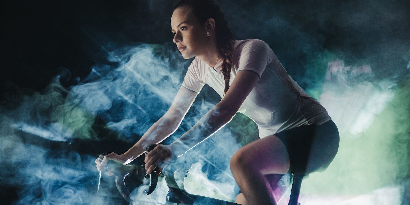 woman riding indoor bicycle
