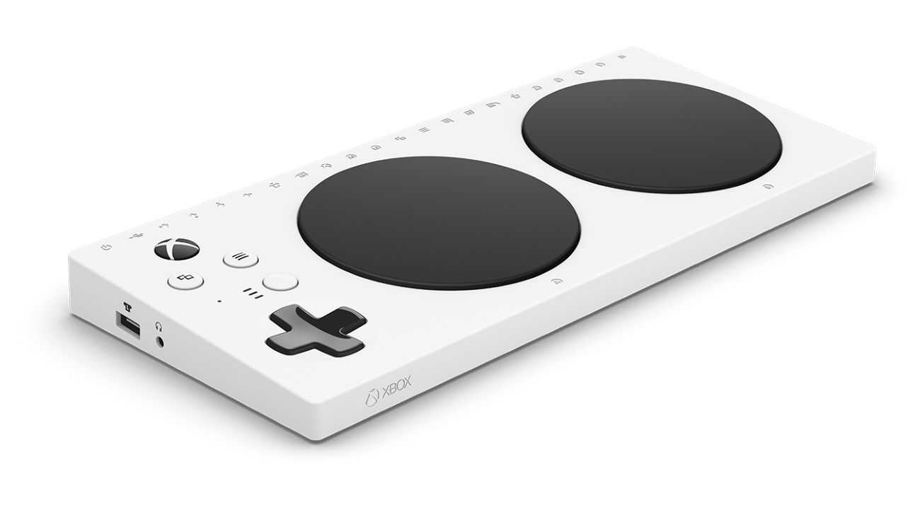 A photograph of the Xbox Adaptive Controller in front of a white background