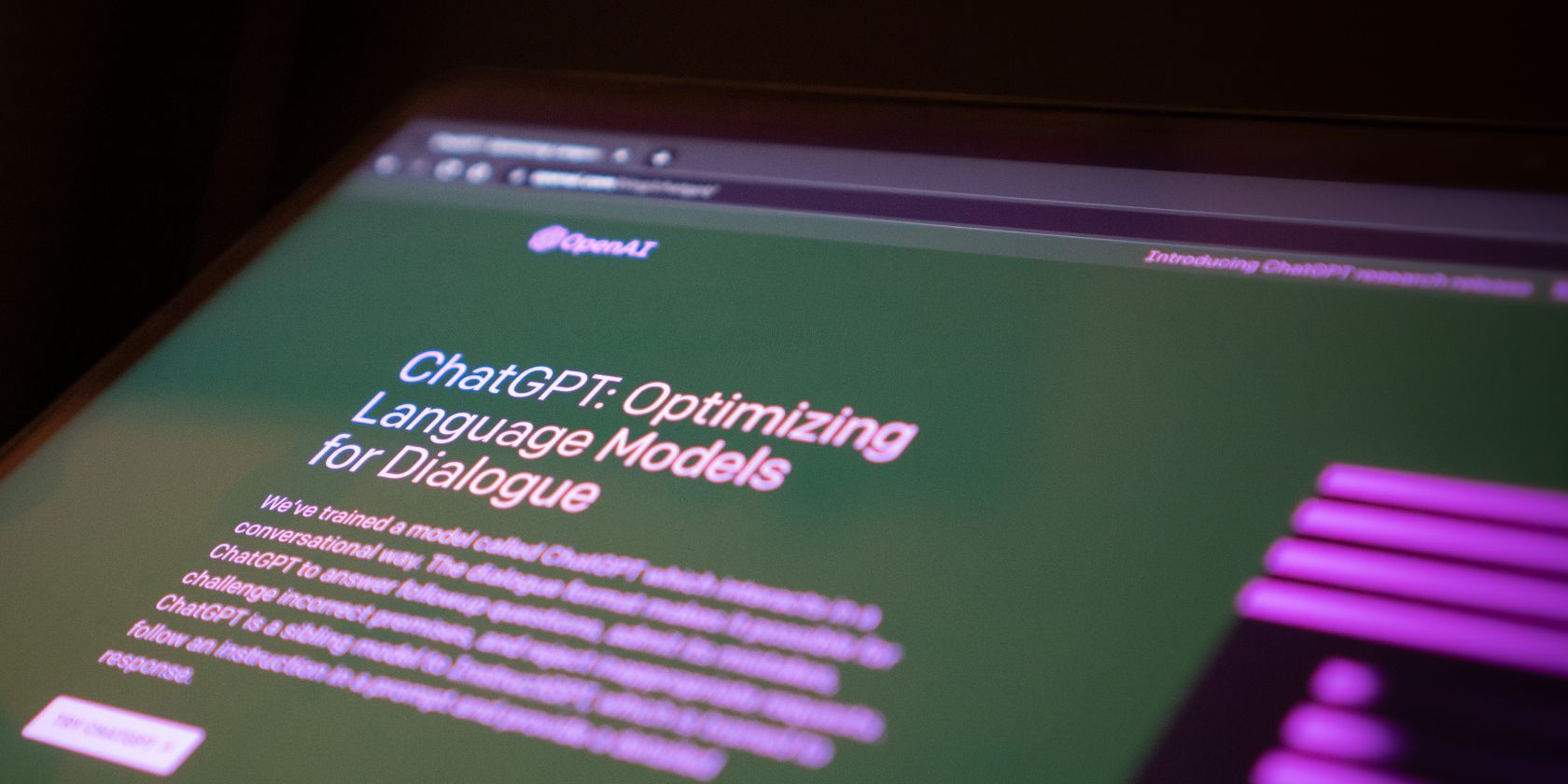 A close up of a computer screen with OpenAI's ChatGPT website