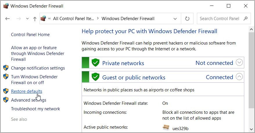 Clicking the Restore defaults option on the Windows Defender Firewall screen