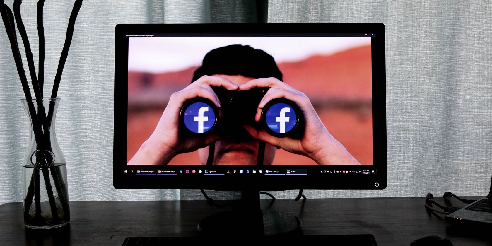 Facebook Icon Binoculars on Computer Screen