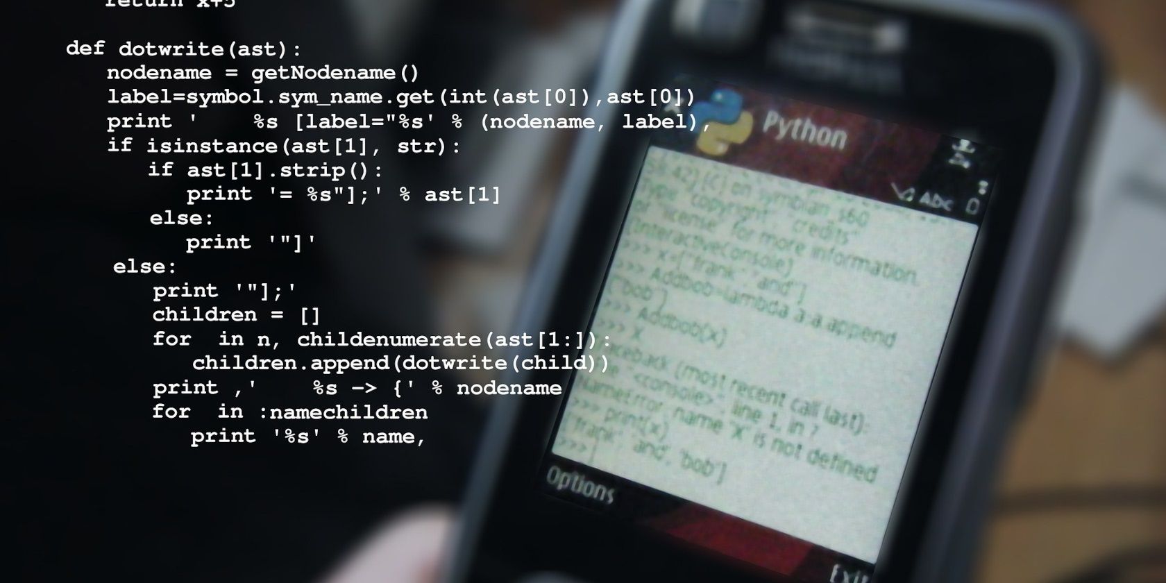 An image showing Python code overlaying a mobile phone