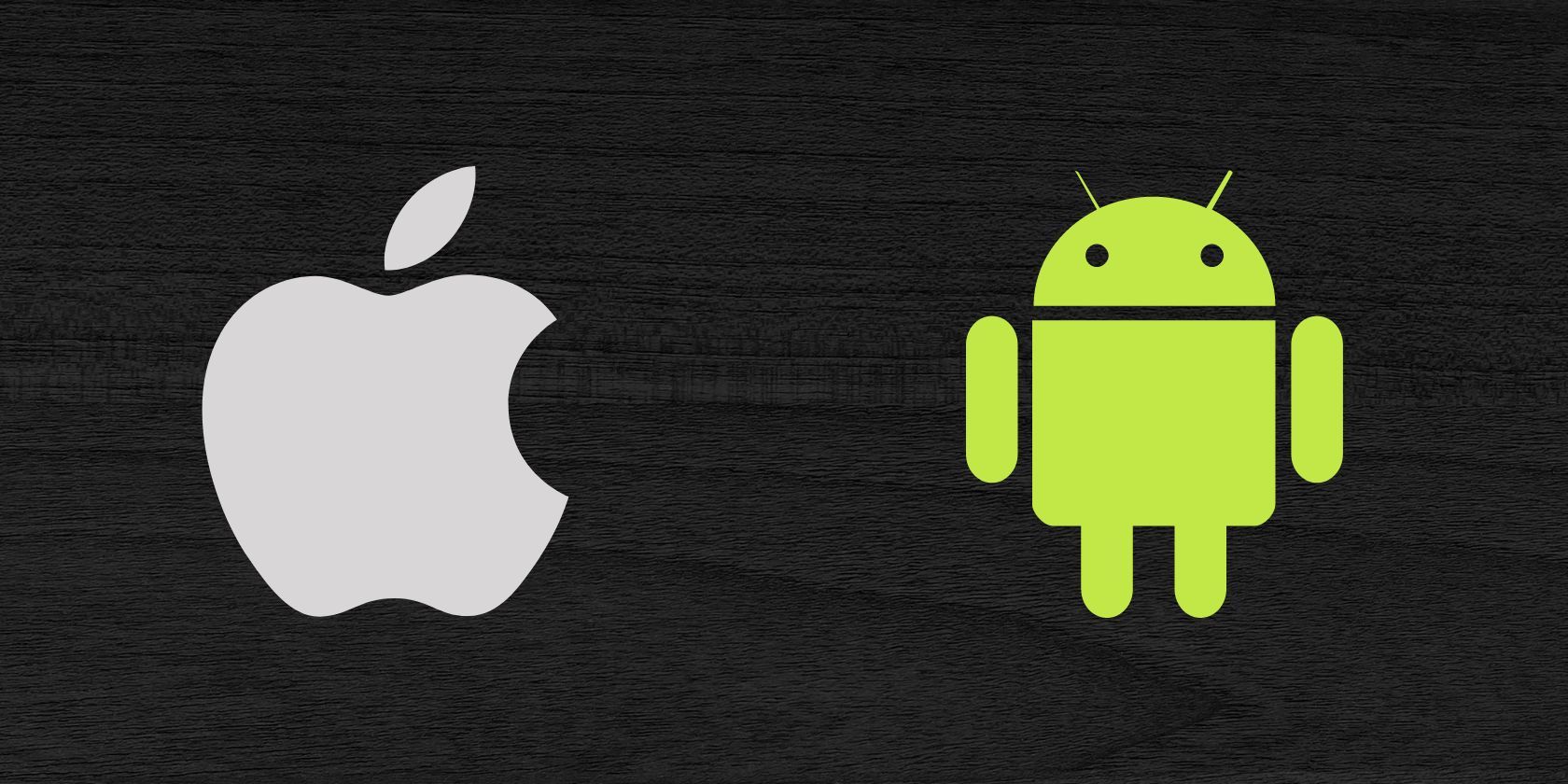 Apple and Android logos seen on dark background