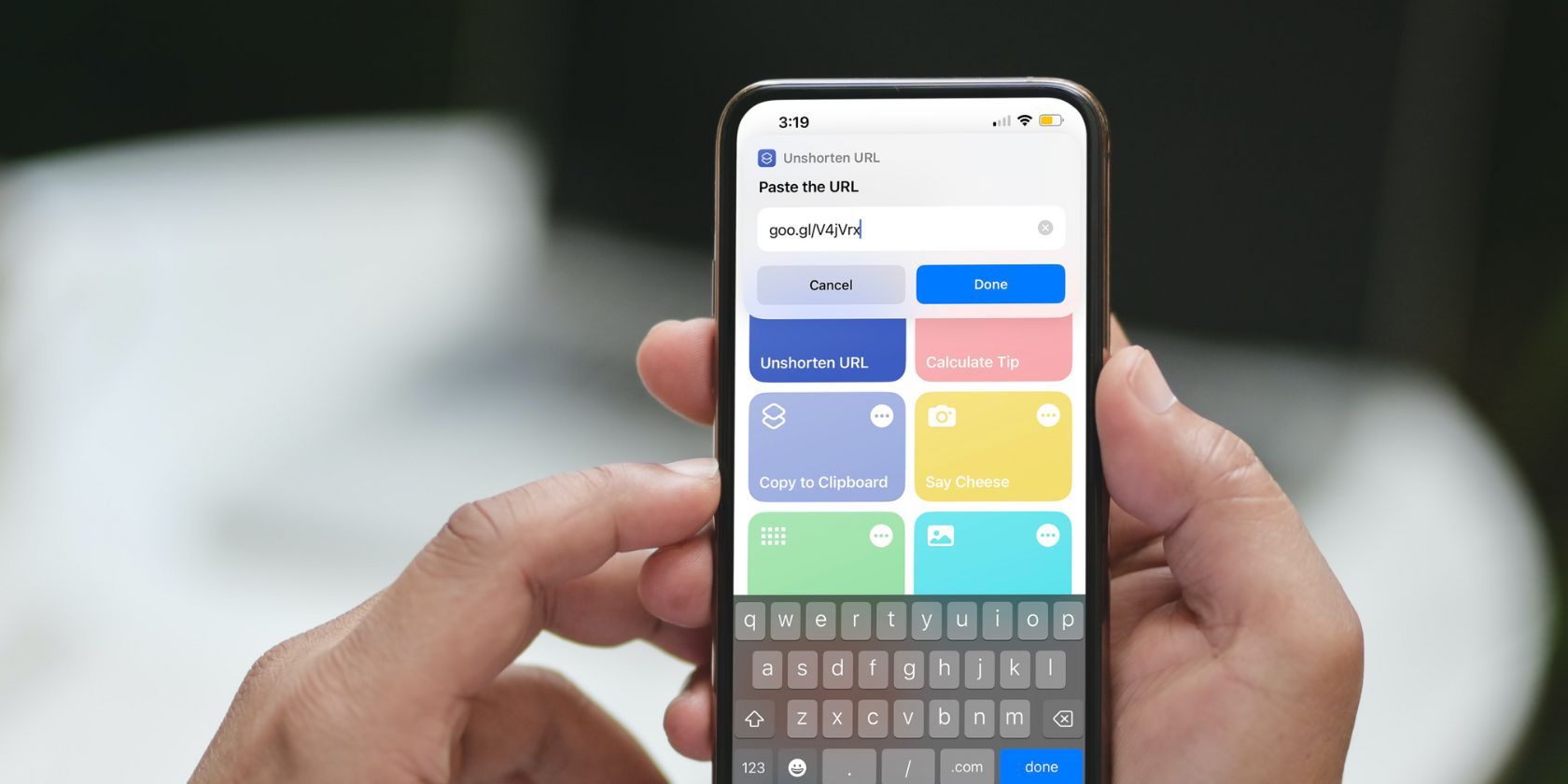 person holding iphone showing shortcuts app