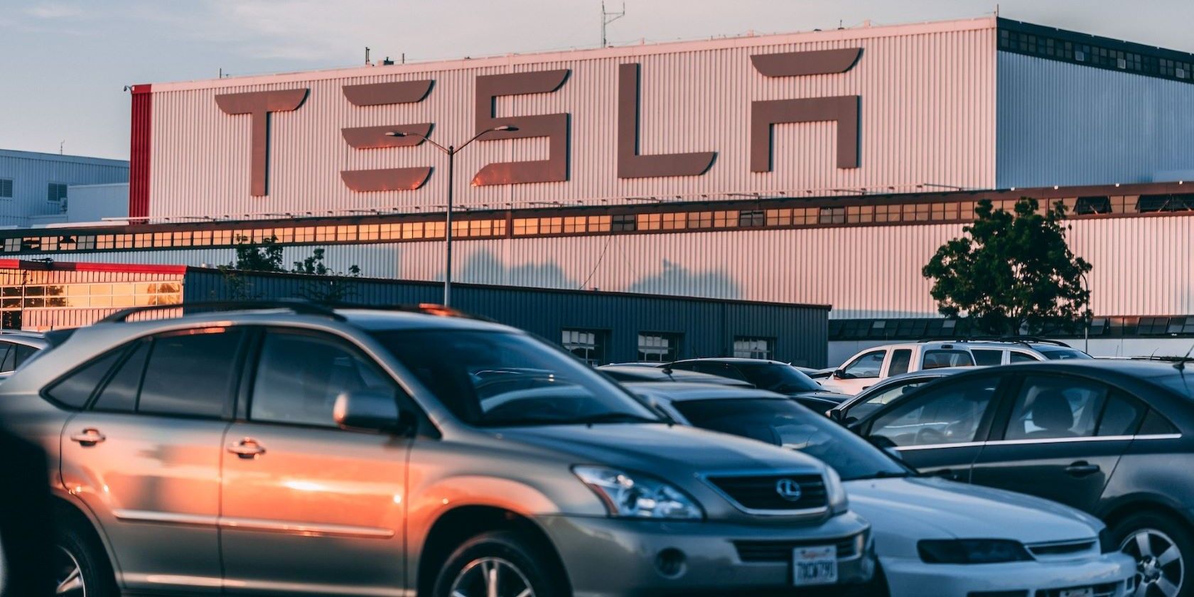parked vehicles in front of Tesla building