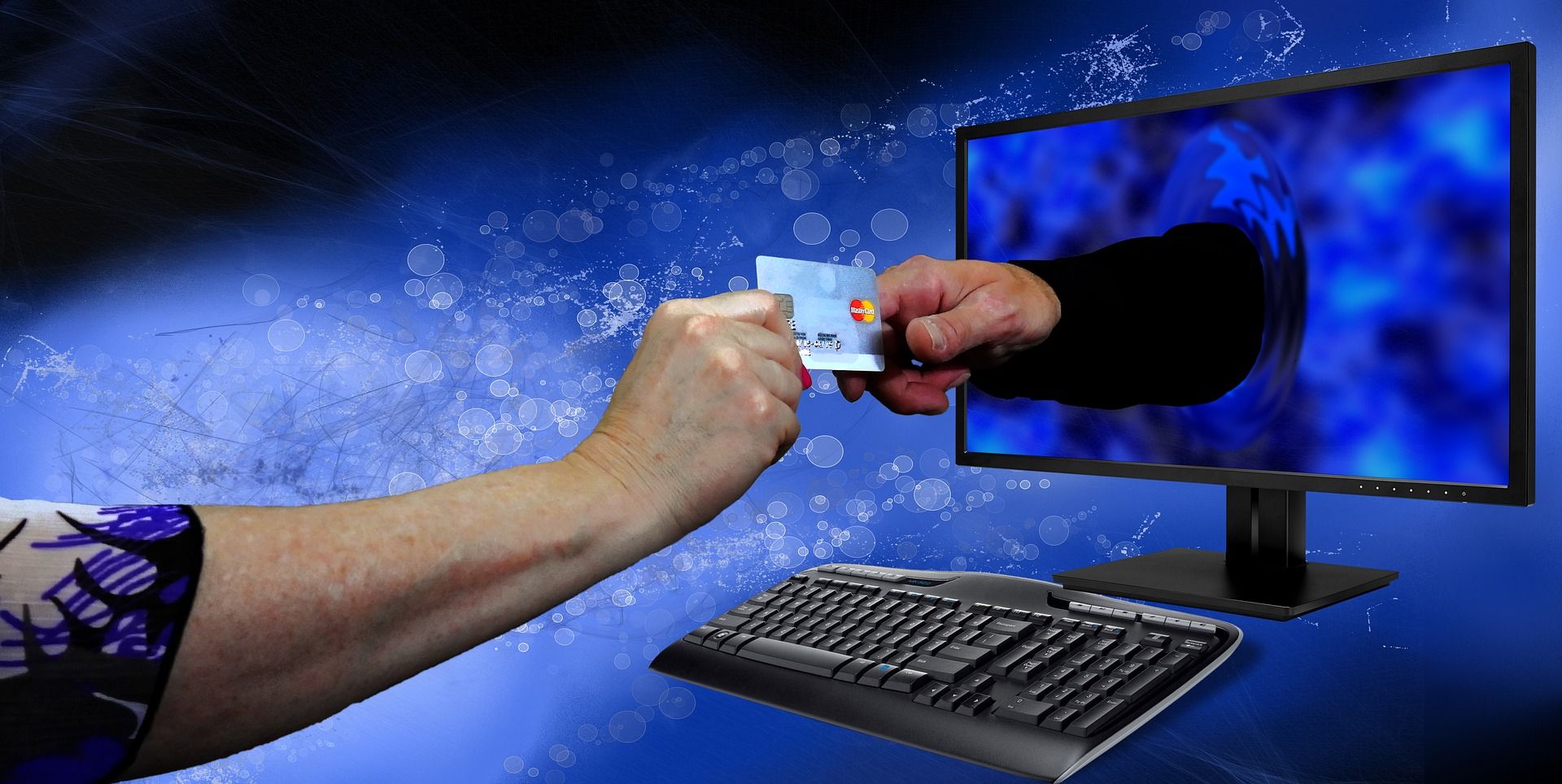 Picture of a credit card being passed into a computer screen