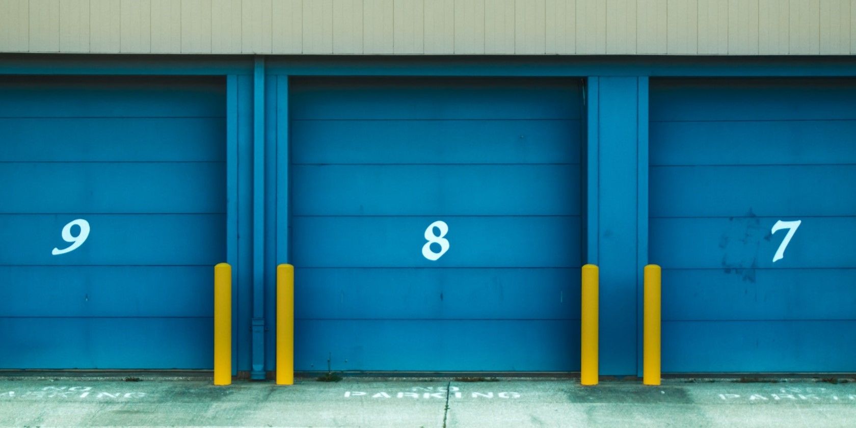 3 numbered storage containers with blue roller shutter doors