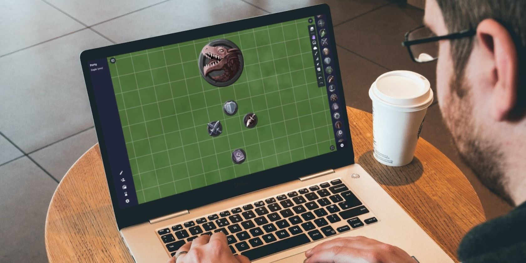 A man using a laptop with a D&D game open on screen