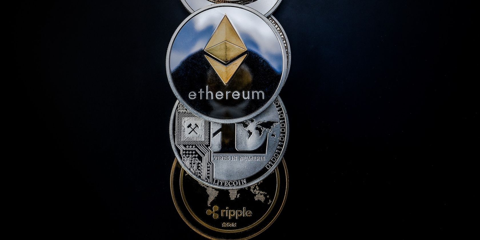 A picture of ethereum, litecoin, and ripple