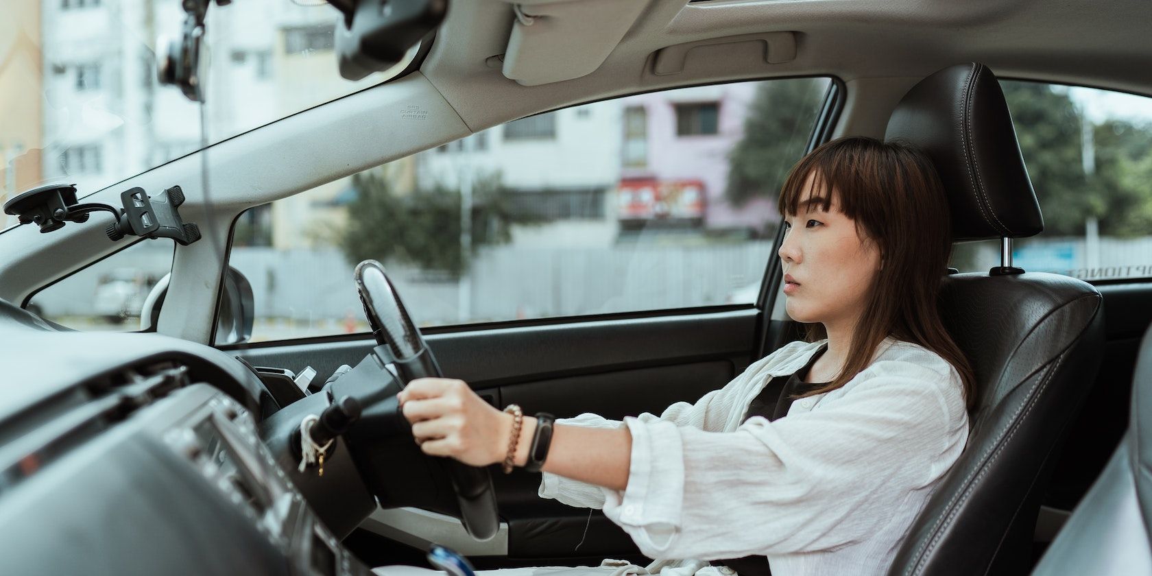 A Woman Driving a Car