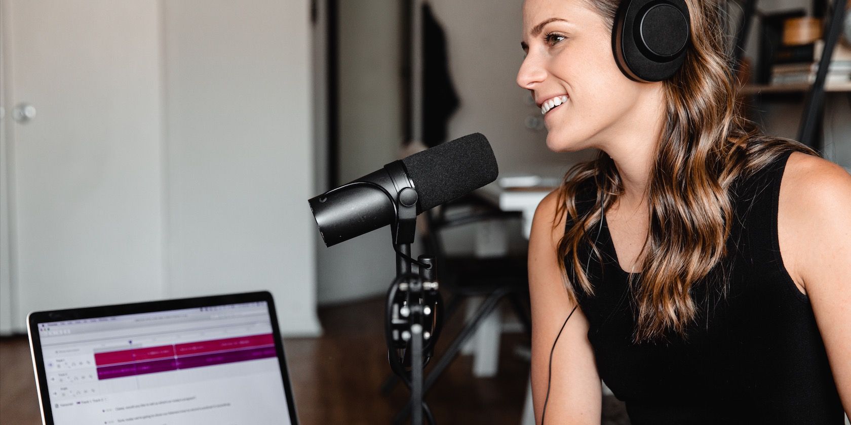 a woman recording a podcast