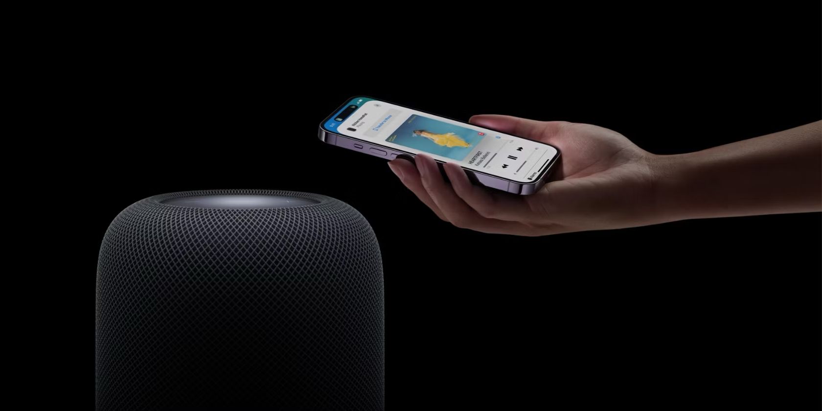 A person demonstrating Apple Music handoff capabilities on a HomePod
