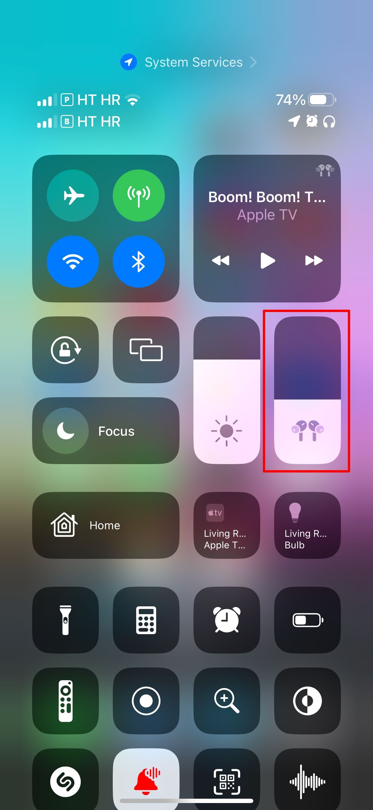 The iPhone Control Center with the Volume slider highlighted