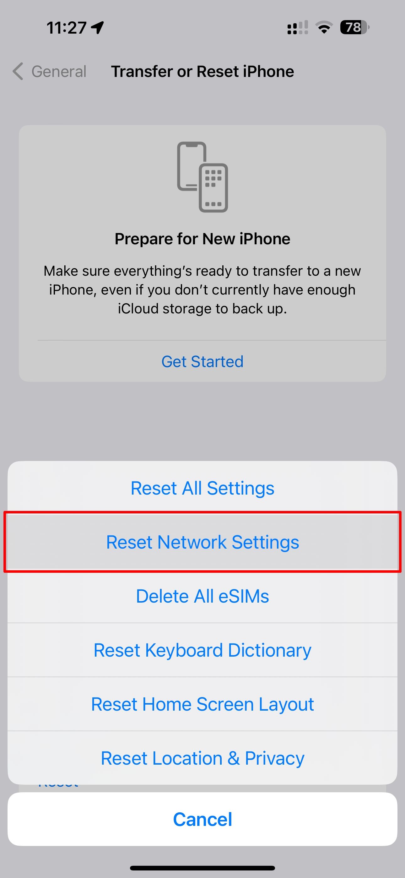 The iPhone Settings app with the Reset Network Settings option highlighted