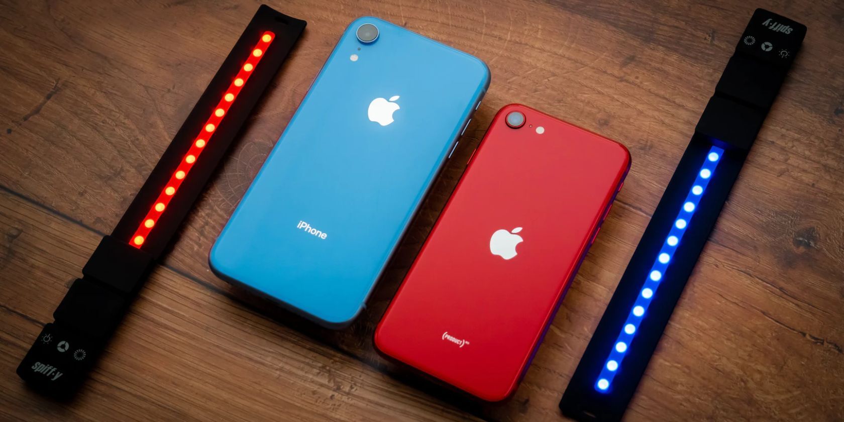 Blue iPhone XR and (PRODUCT)RED iPhone SE side by side