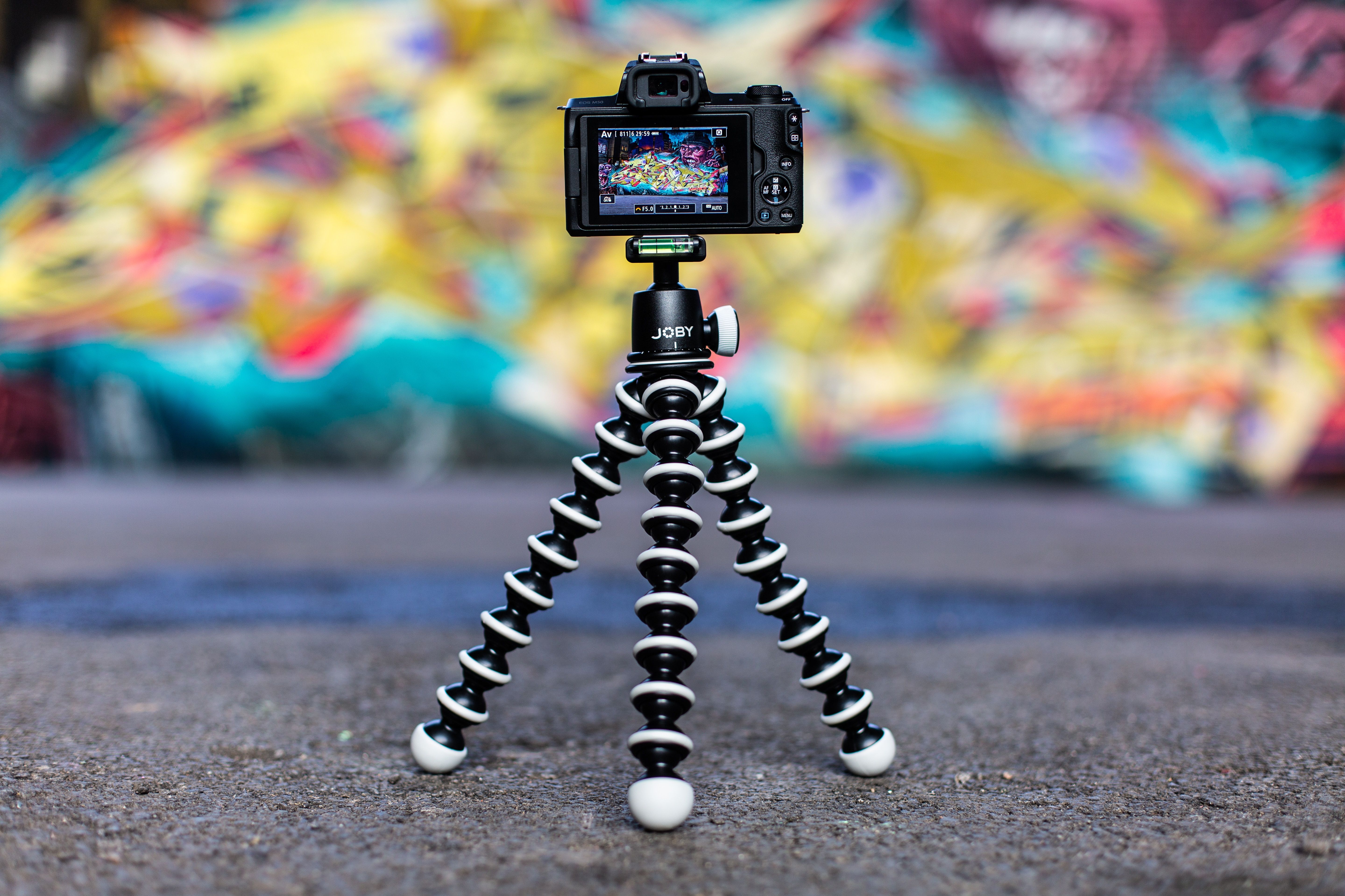 camera-on-tripod-against-colorful-background