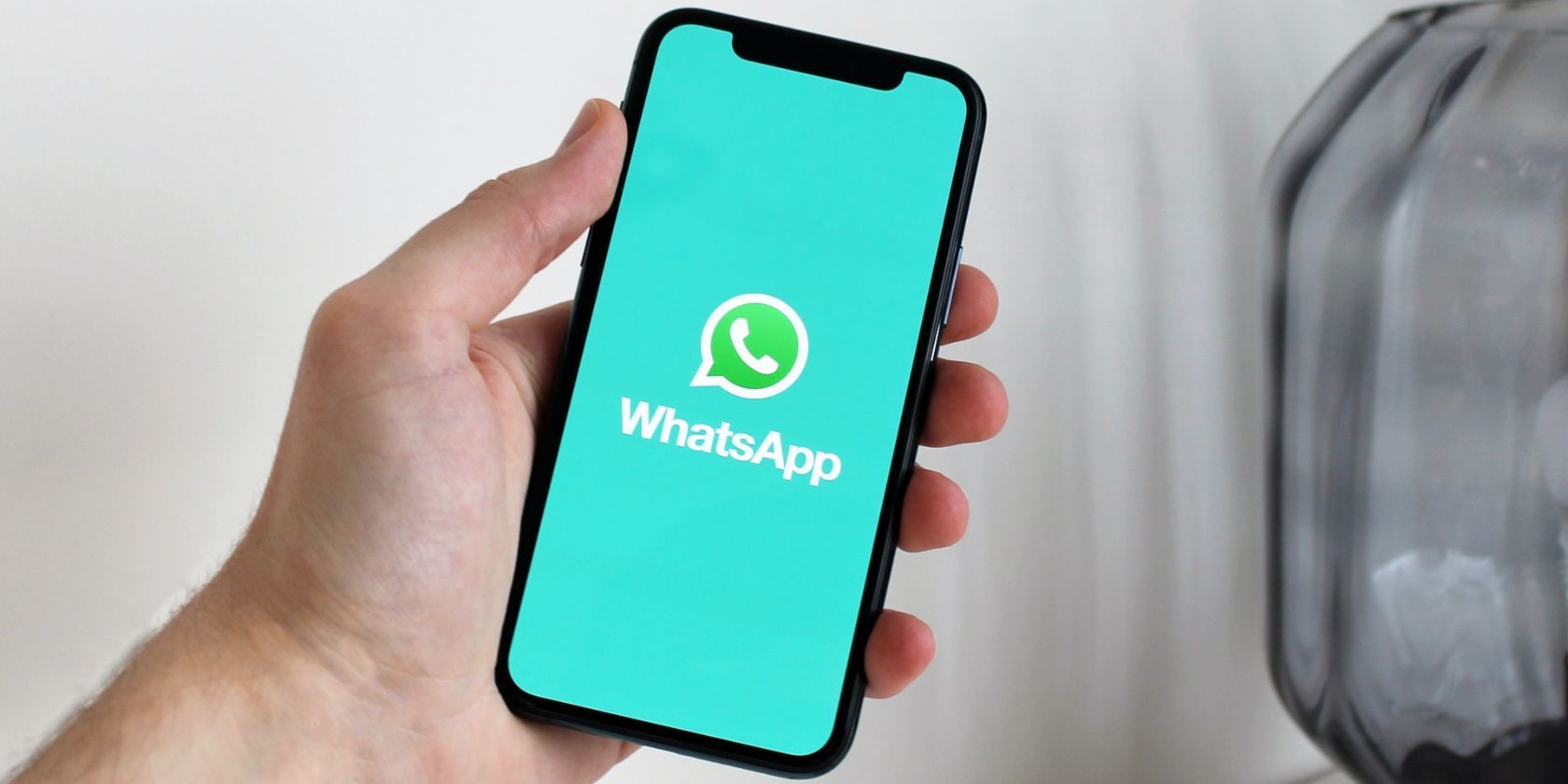 Cell phone with WhatsApp logo screen