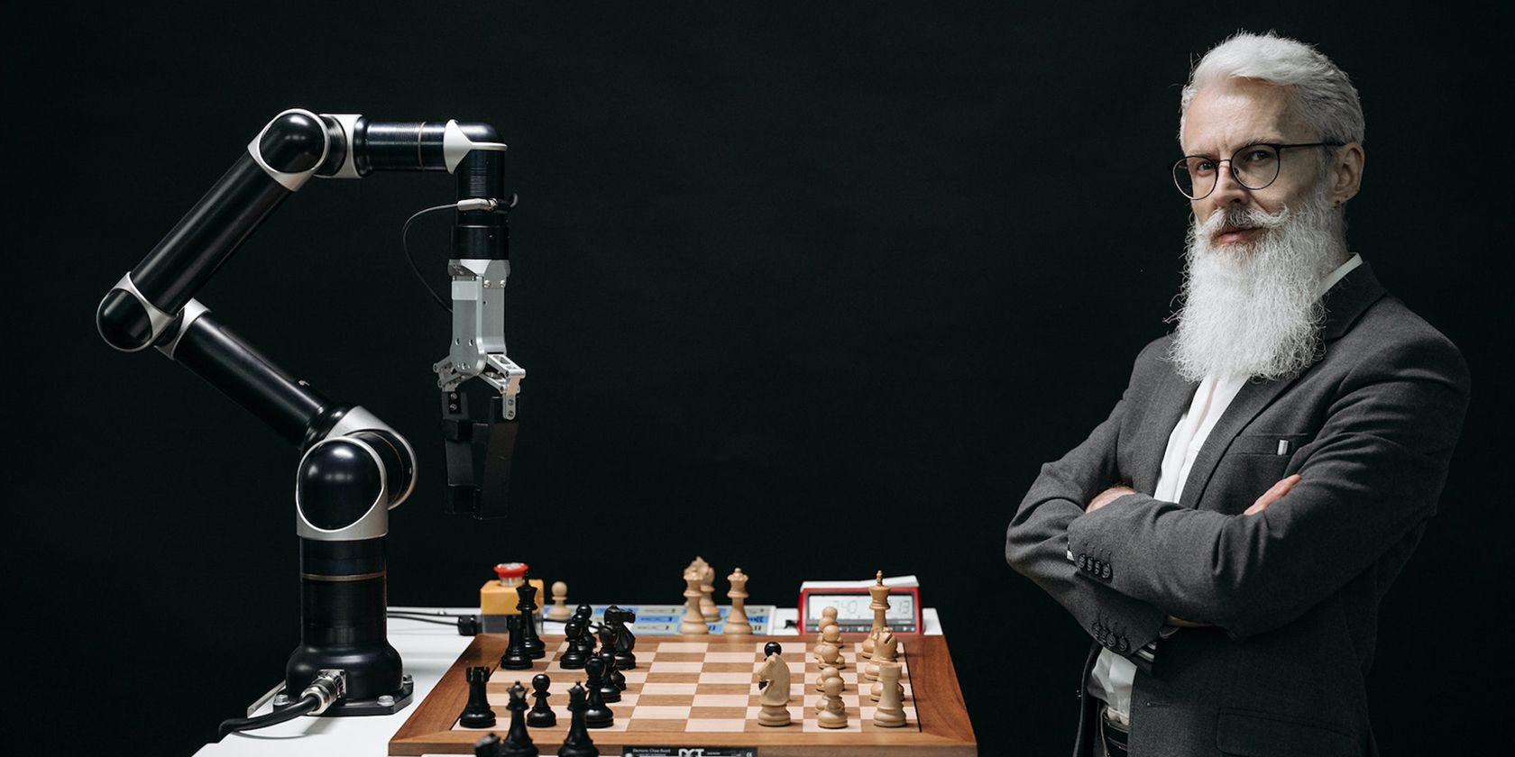 Cover image of a man playing chess against a robot